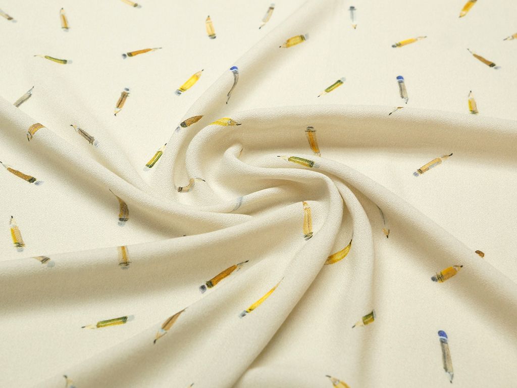 Ткань плательная вискозная, на кремовом фоне цветные карандашиизображение