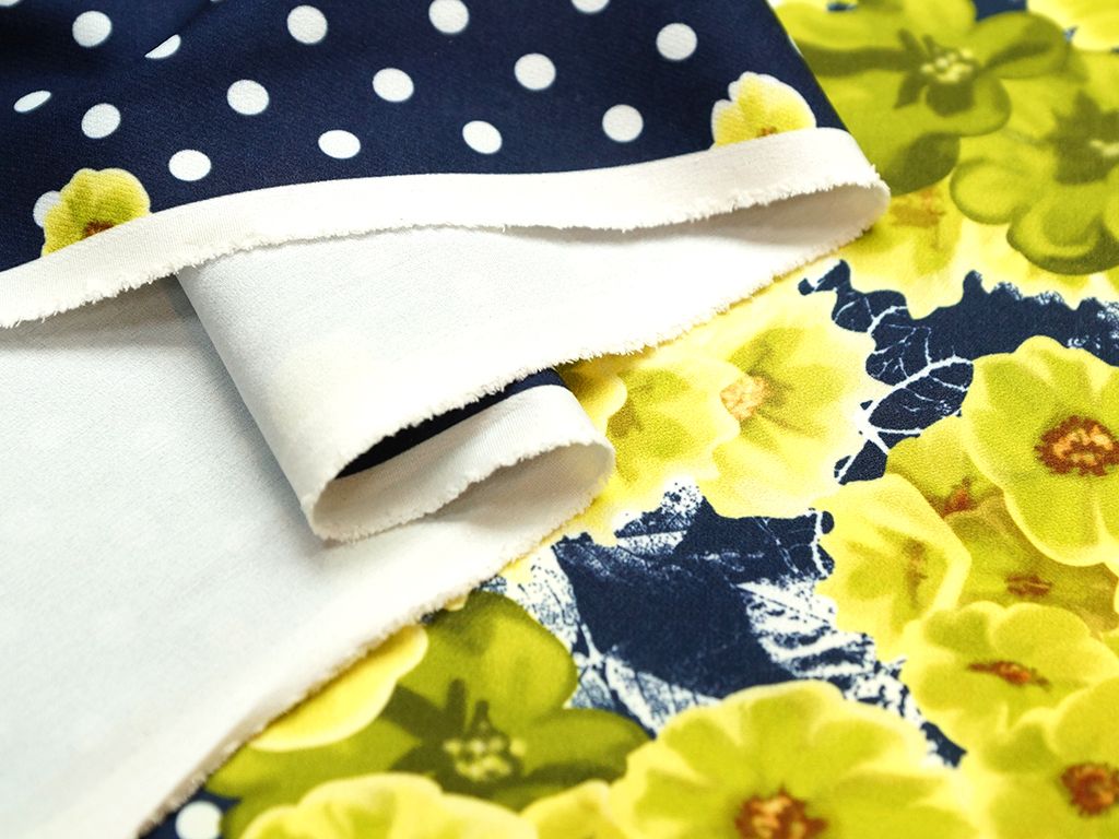 Приобрести Ткань плательная,цвет:на темно синем фоне белый горох с желто-зелеными корсетными цветами в середине