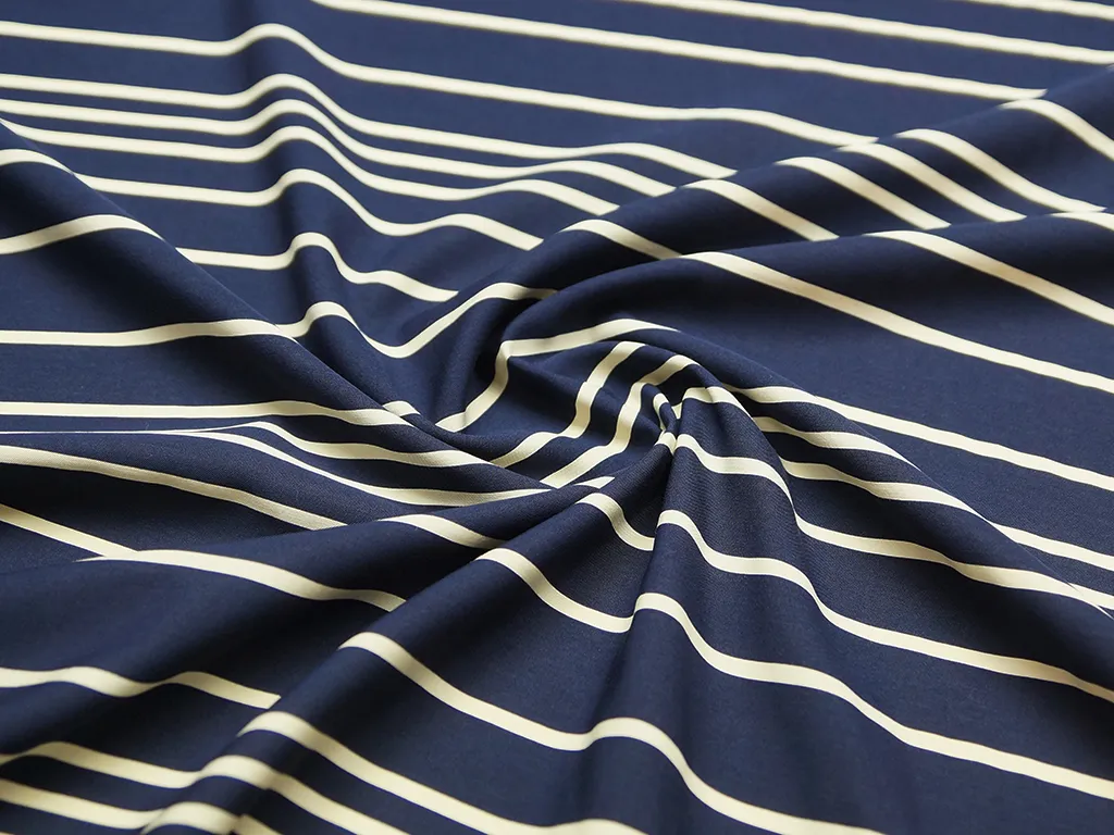 Плательная ткань в горизонтальную полоску на темно-синем фонеизображение